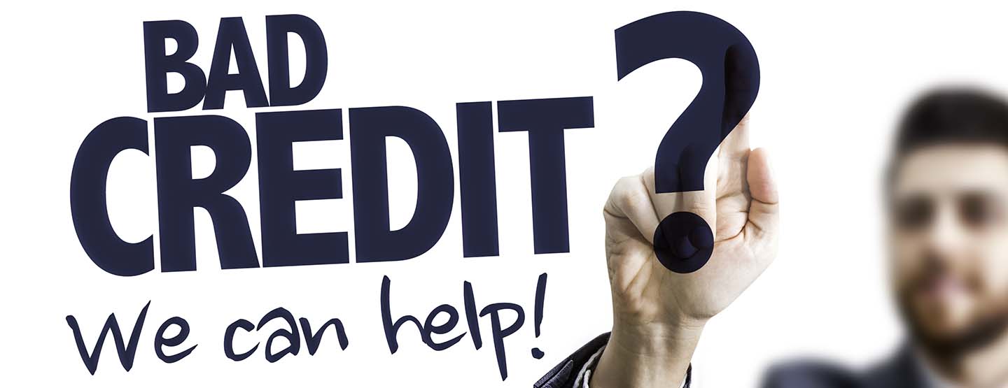 Business Man Pointing the Text: Bad Credit? We Can Help!